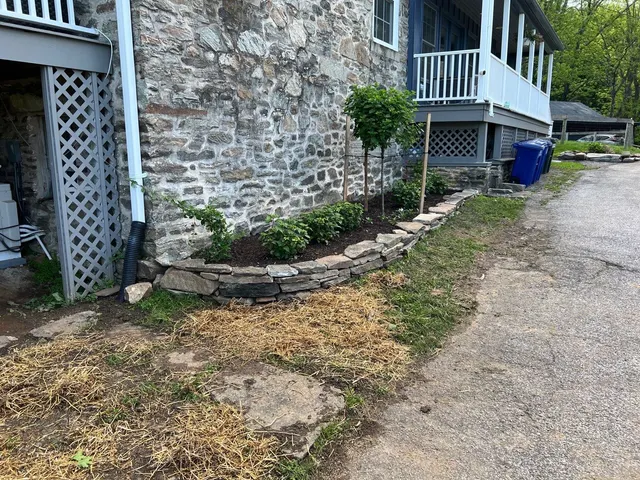Extend wall and add plantings